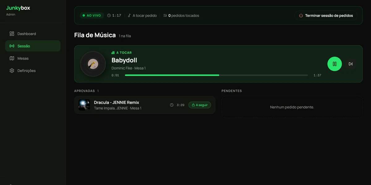 The Junkybox live session screen: a now-playing track with transport controls, an approved queue, and an empty pending column.